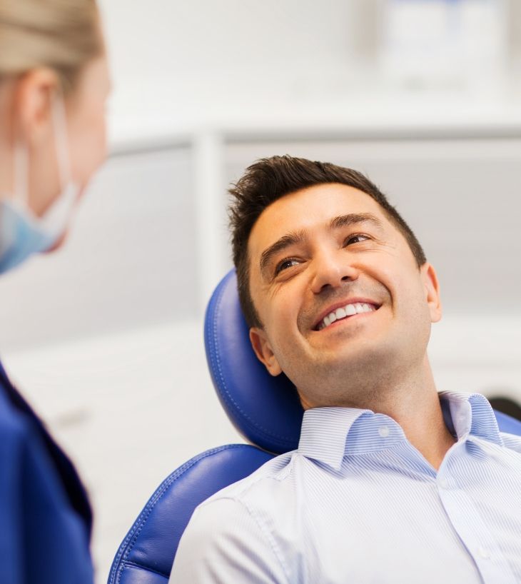 Man smiling at dentist