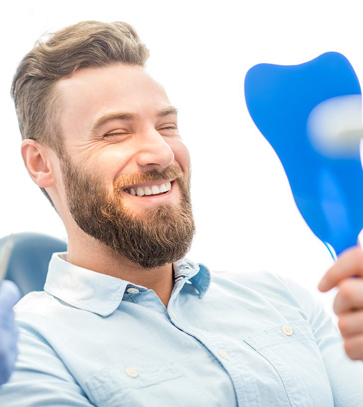 man with beard laughing and smiling